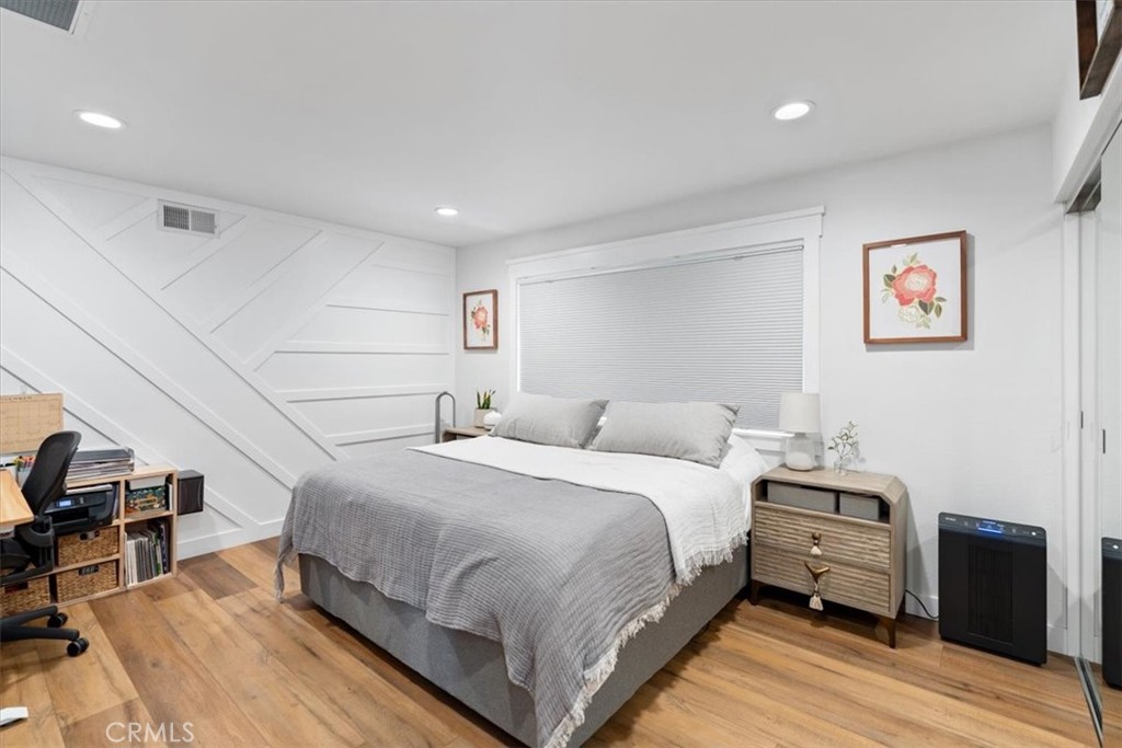 16873 Donwest Tustin, CA 92780 - Photo 33 of 42 a bedroom with a bed and wooden floor