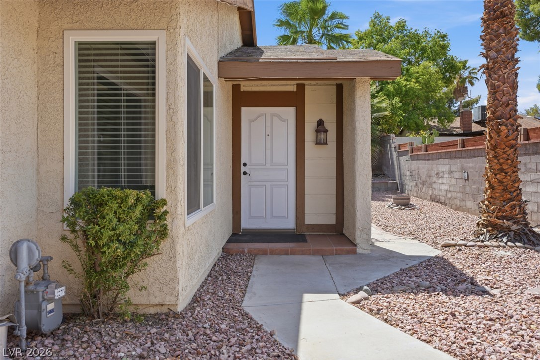 3971 Spring Leaf Drive Las Vegas, NV 89147 - Photo 10 of 48 A welcoming entry, with a sheltered front door, greets guests with charm and function.