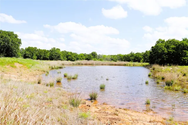 a view of a lake and sunset