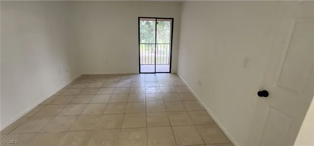 a view of an empty room with windows