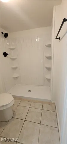 a bathroom with a toilet and a bathtub