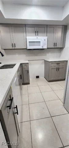 a kitchen with a cabinets and window