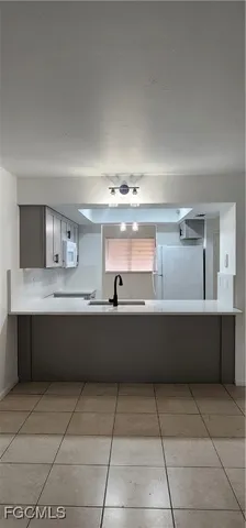 a kitchen with a cabinets and window