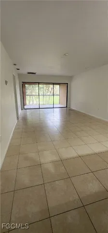 a view of empty room with windows