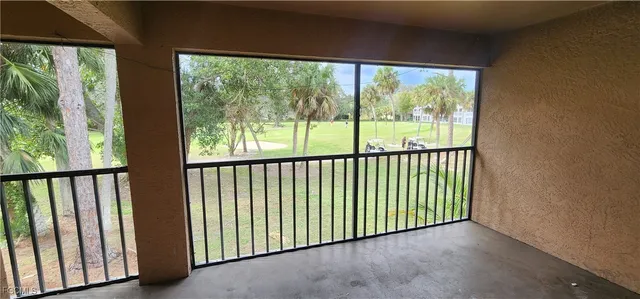 a view of an empty room with windows
