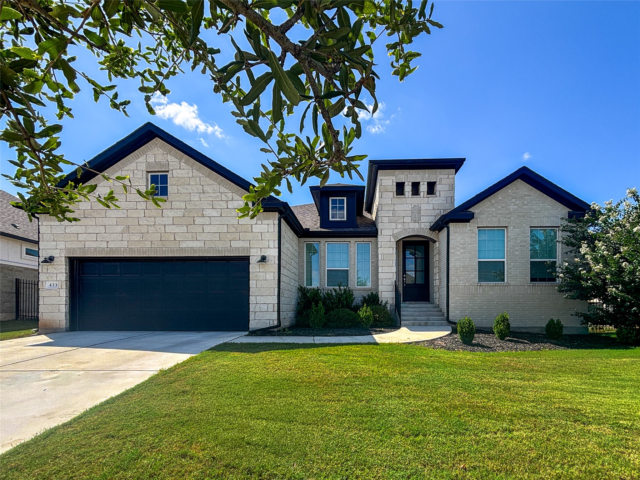 433 Running Bird Road Austin, TX 78737 - Photo 1 of 1 A striking stone and brick exterior welcomes you home to this meticulously maintained residence.