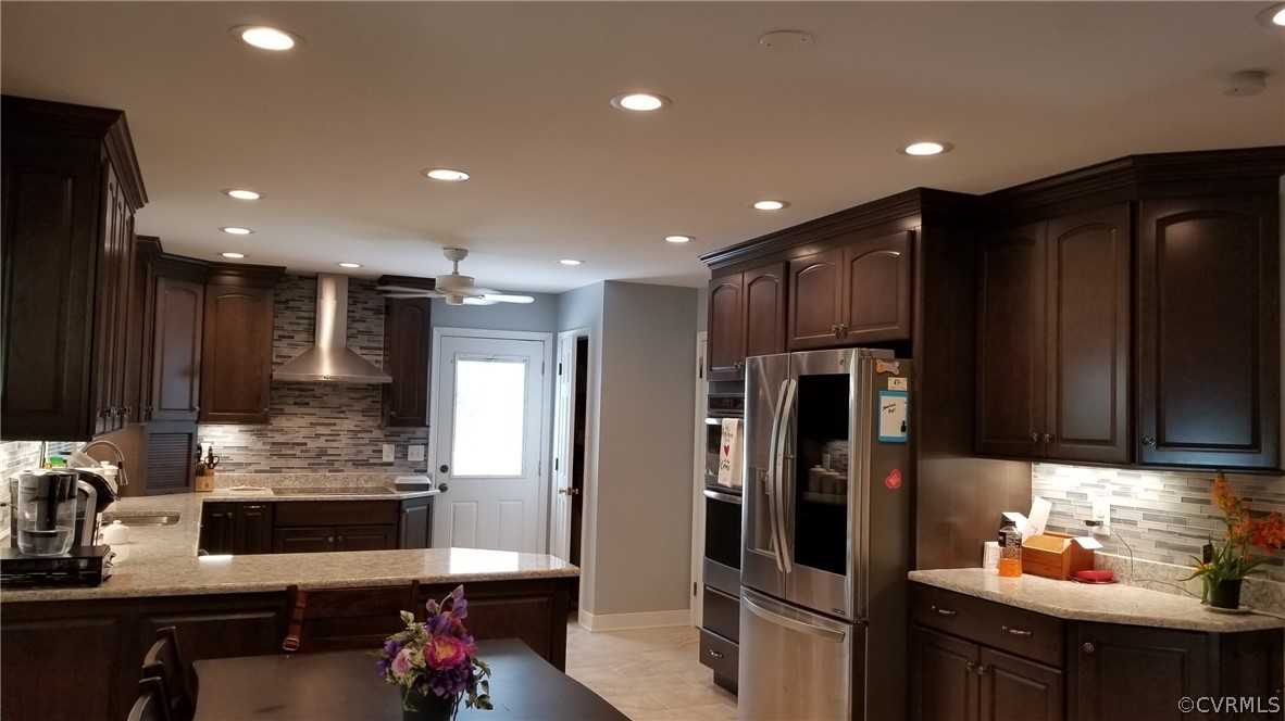 12901 Silver Crest Road Chester, VA 23831 - Photo 11 of 42 a kitchen with stainless steel appliances kitchen island granite countertop a refrigerator and a stove top oven