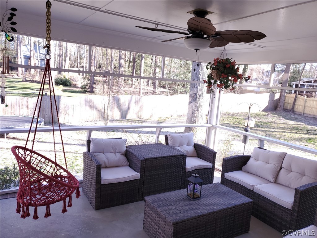 12901 Silver Crest Road Chester, VA 23831 - Photo 14 of 42 a living room with furniture and a large window