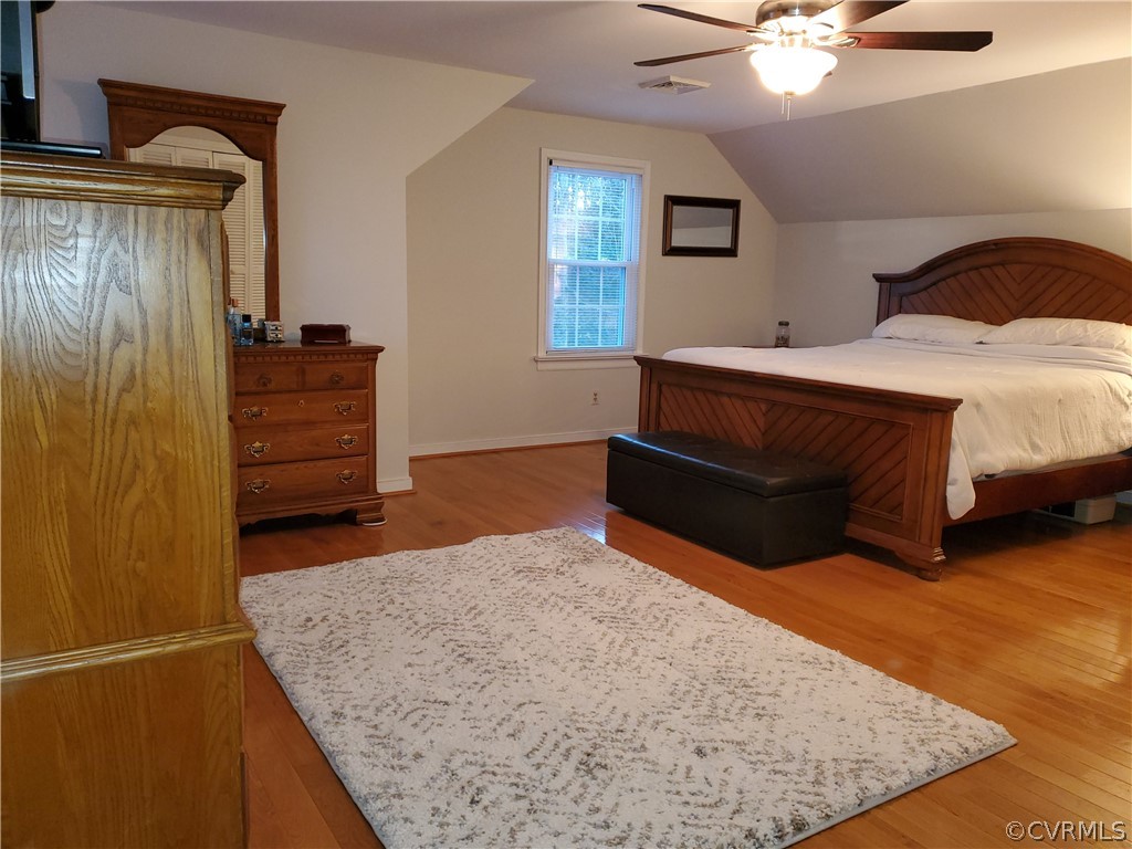 12901 Silver Crest Road Chester, VA 23831 - Photo 16 of 42 a bedroom with a bed and a dresser