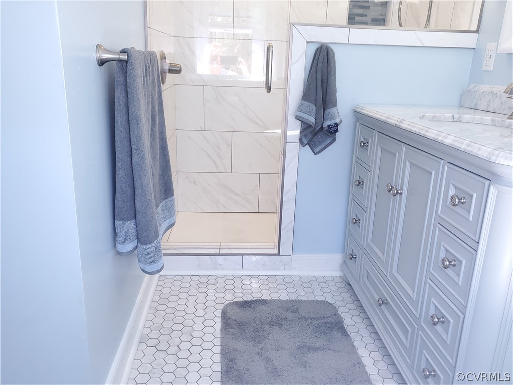 12901 Silver Crest Road Chester, VA 23831 - Photo 19 of 42 a bathroom with a granite countertop shower and vanity