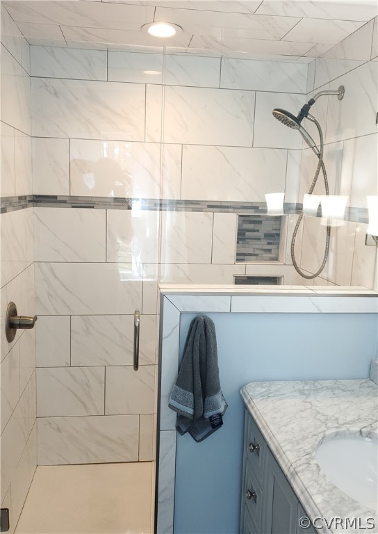 12901 Silver Crest Road Chester, VA 23831 - Photo 20 of 42 a bathroom with a granite countertop sink a mirror and shower