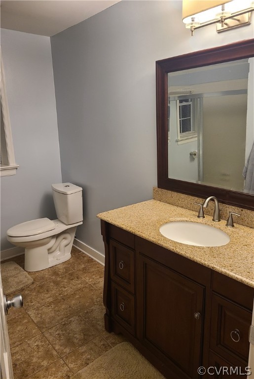 12901 Silver Crest Road Chester, VA 23831 - Photo 27 of 42 a bathroom with a granite countertop sink and a toilet
