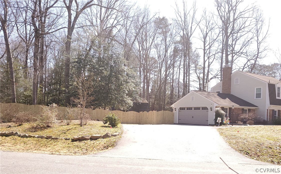 12901 Silver Crest Road Chester, VA 23831 - Photo 3 of 42 a front view of a house with a yard