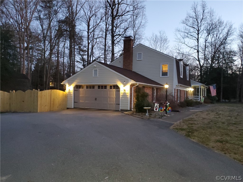 12901 Silver Crest Road Chester, VA 23831 - Photo 40 of 42 a view of a house with large space and a car parked in front of it