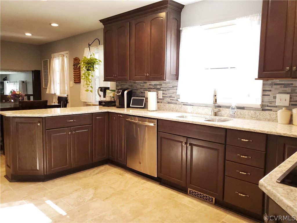 12901 Silver Crest Road Chester, VA 23831 - Photo 10 of 42 a kitchen with a sink a stove and cabinets