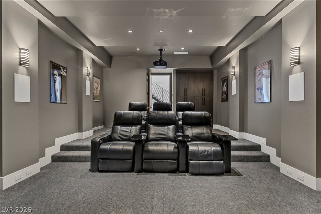 657 Ridgestone Rim Court Henderson, NV 89012 - Photo 64 of 97 Multi-level seating areas and recessed lighting define this custom home theater space.