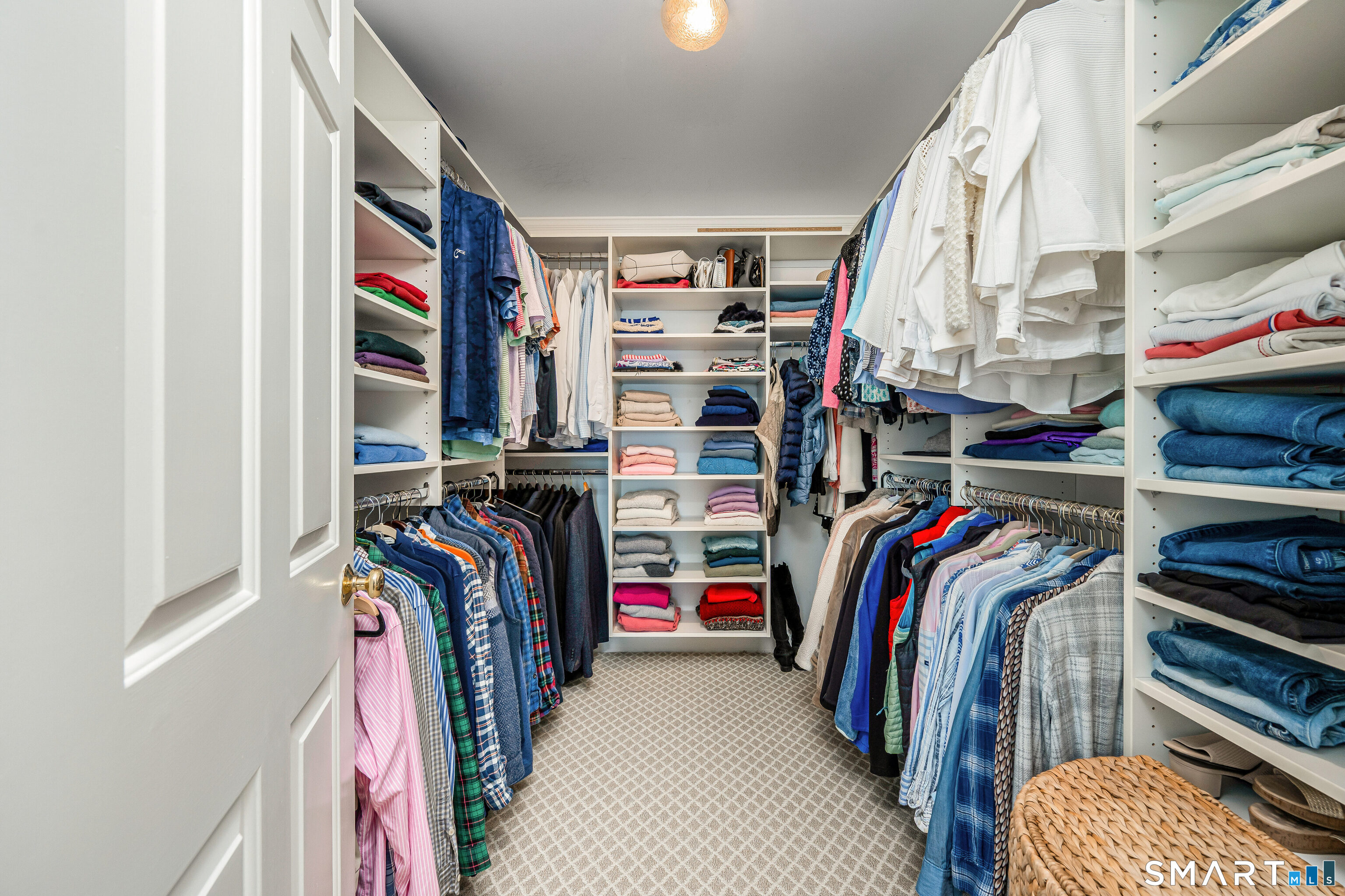 43 Phillips Lane Darien, CT 06820 - Photo 11 of 29 a view of walk in closet with clothes and shoes