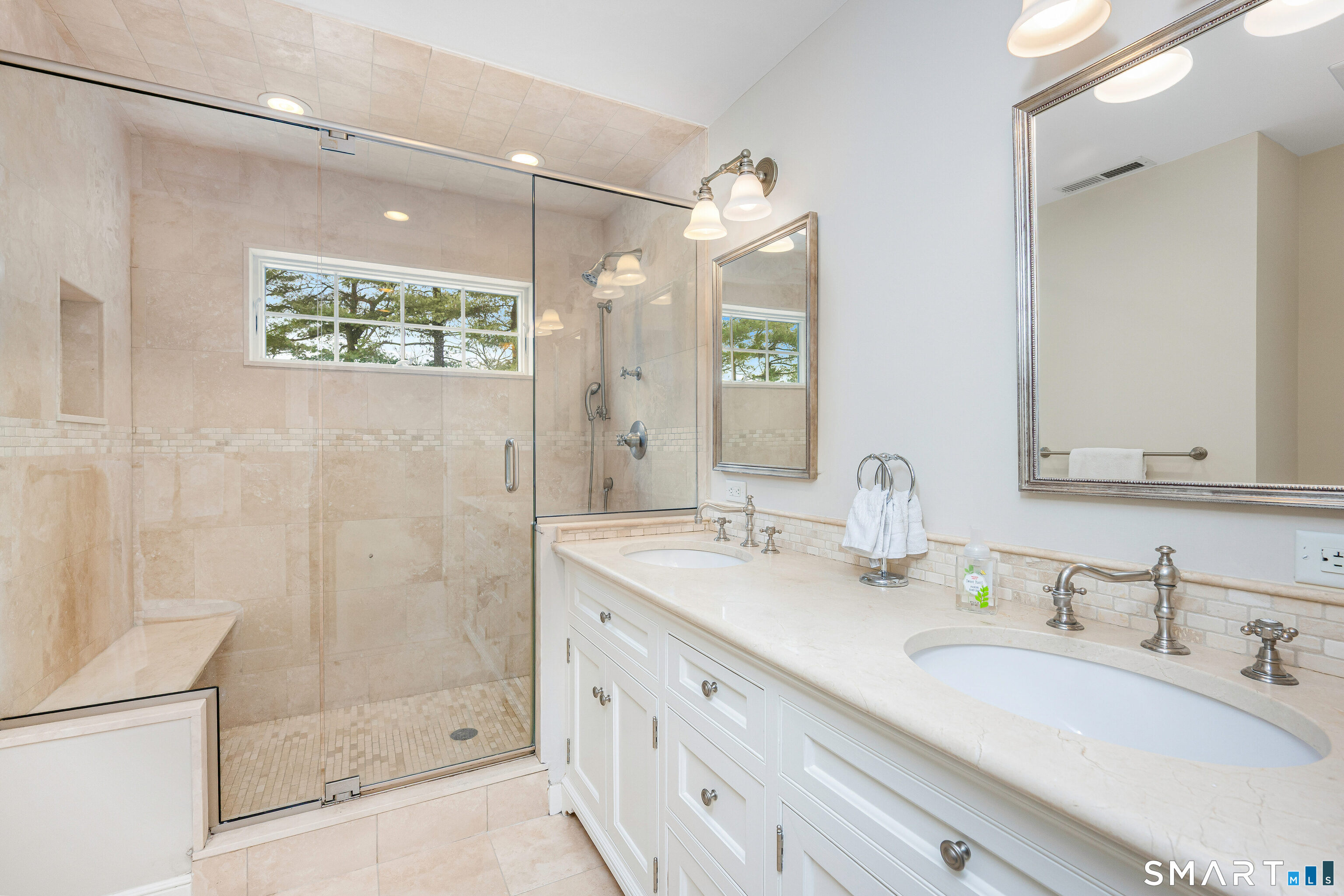 43 Phillips Lane Darien, CT 06820 - Photo 12 of 29 a bathroom with a double vanity sink mirror and shower