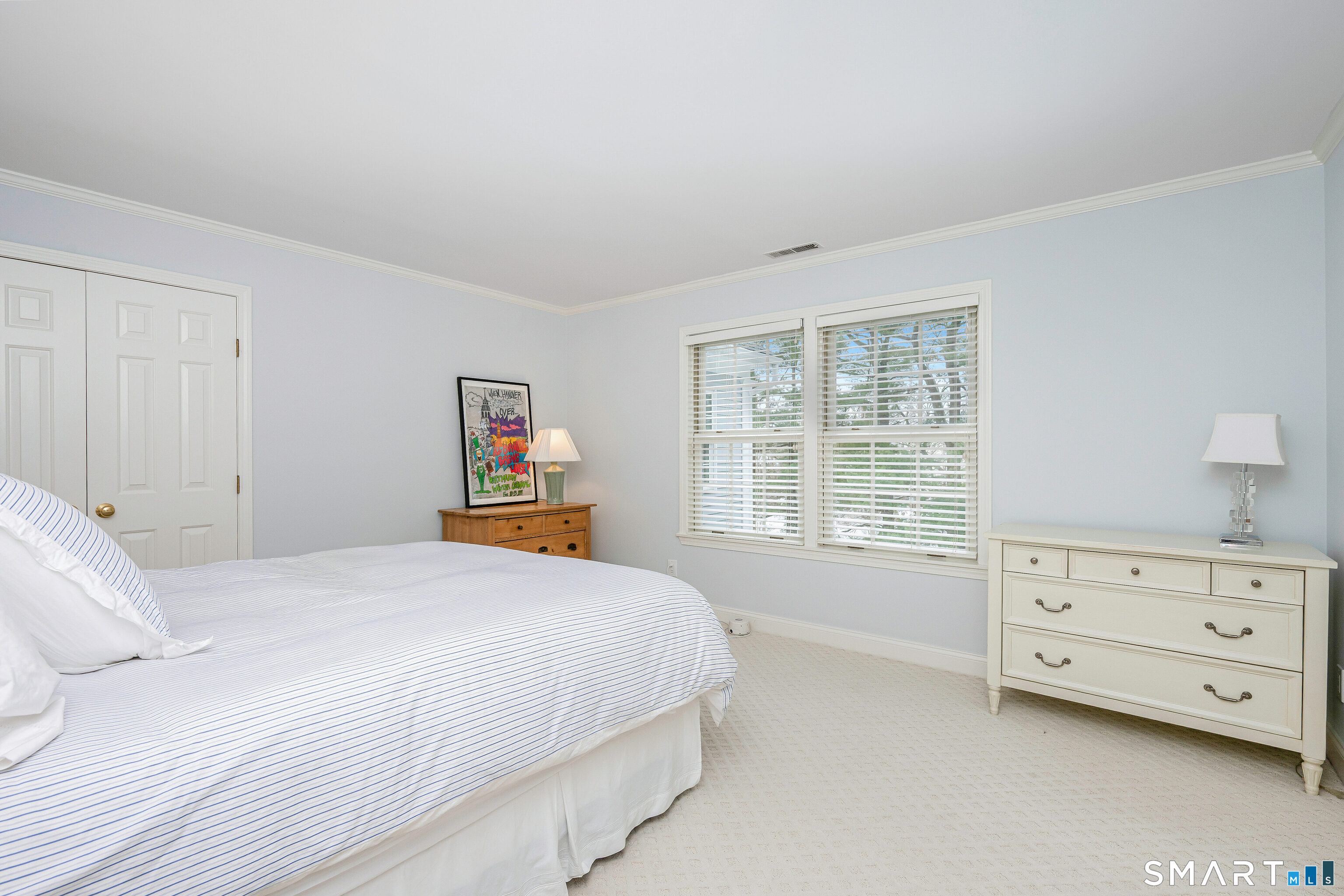 43 Phillips Lane Darien, CT 06820 - Photo 13 of 29 a bedroom with a bed and a window