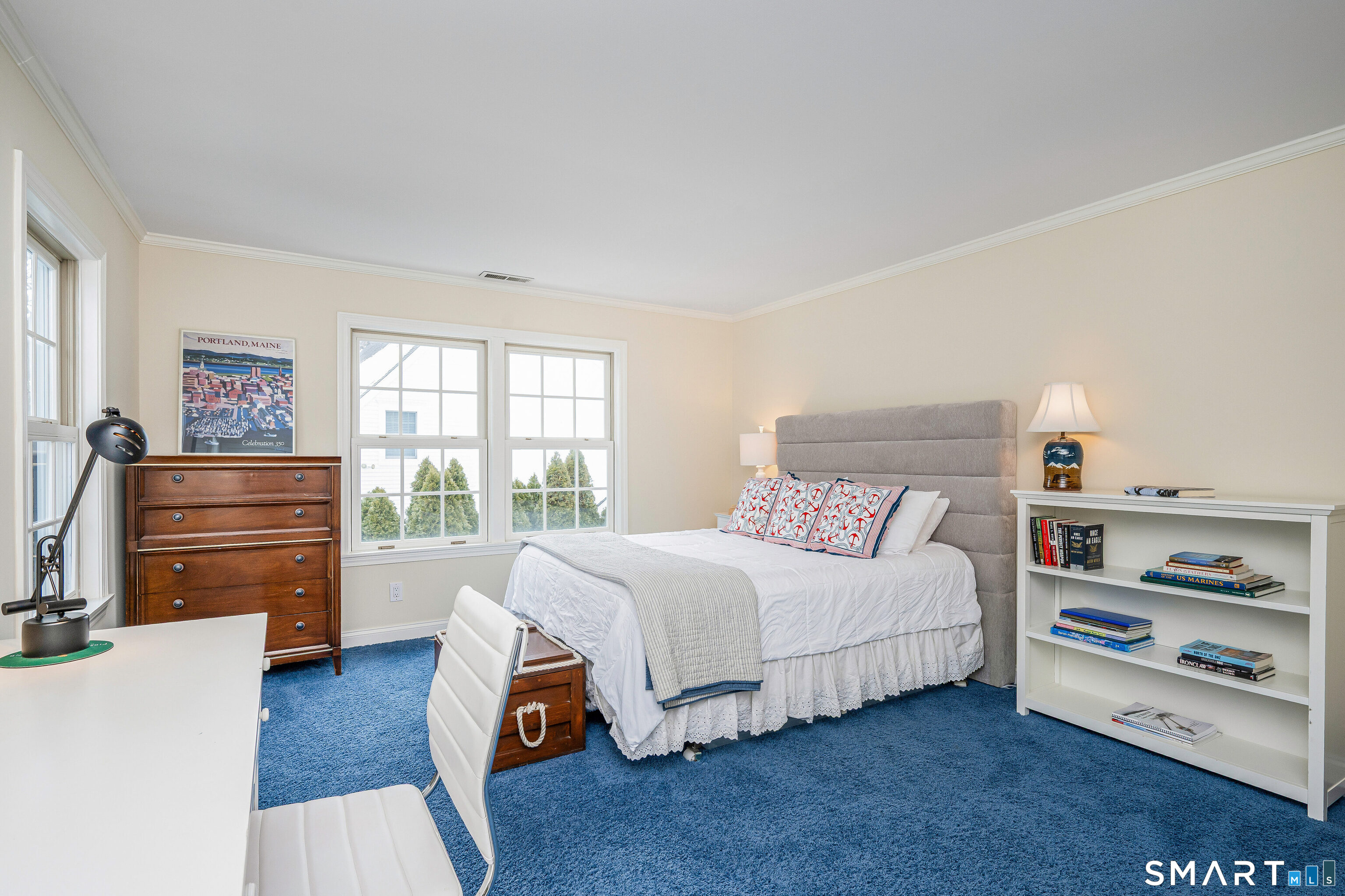 43 Phillips Lane Darien, CT 06820 - Photo 16 of 29 a bedroom with a bed and a dresser next to a window