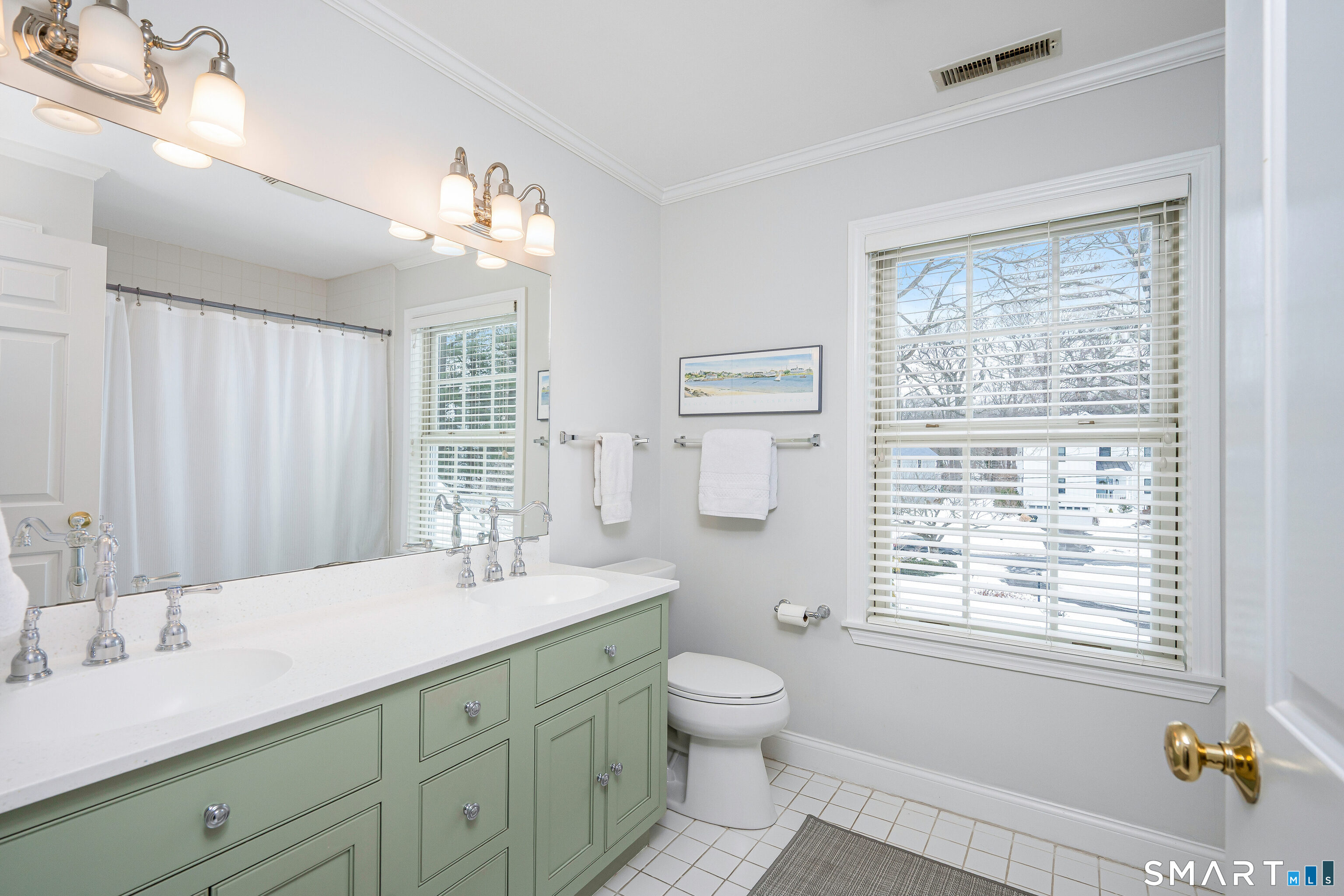 43 Phillips Lane Darien, CT 06820 - Photo 17 of 29 a bathroom with a double vanity sink toilet and a bathtub
