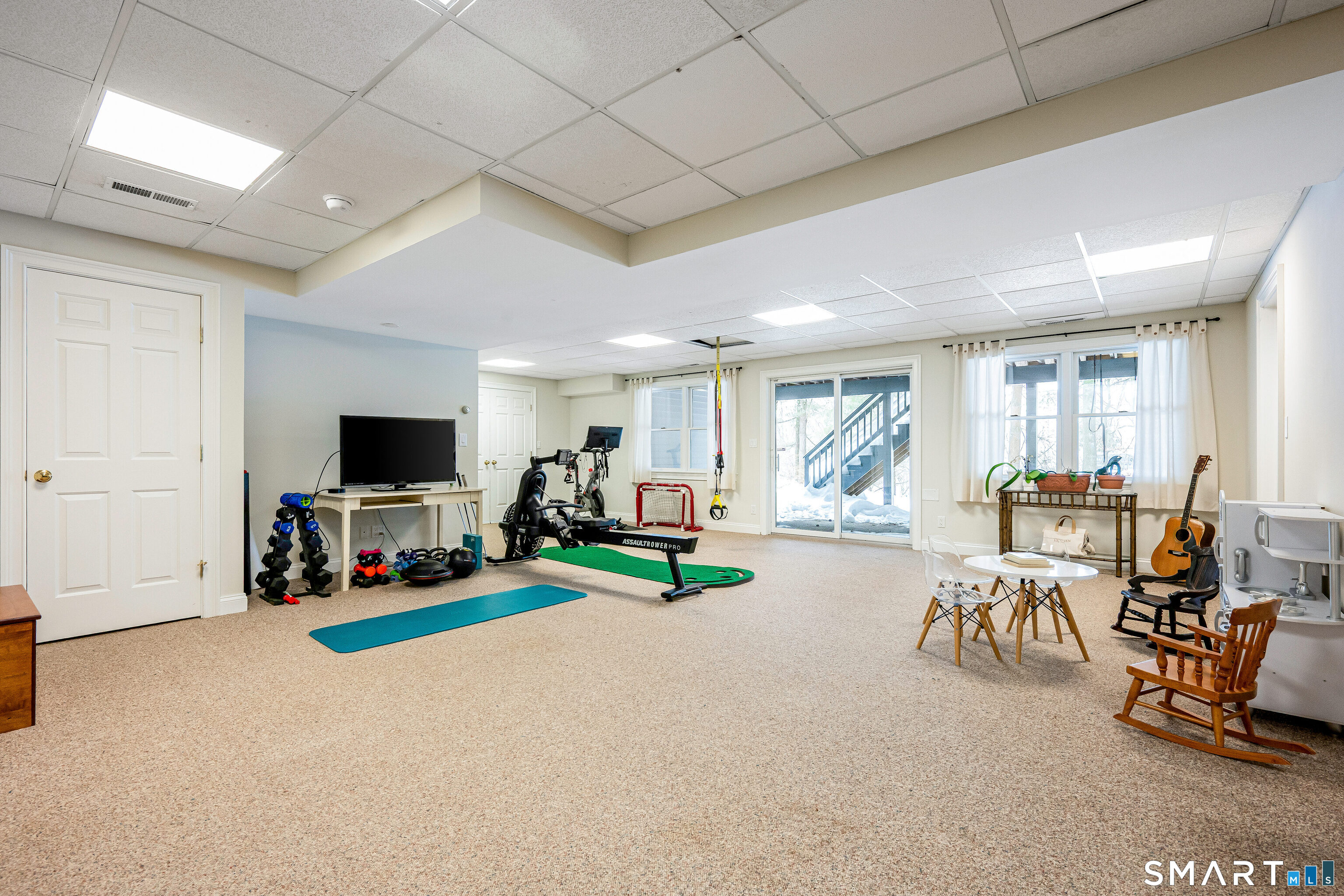 43 Phillips Lane Darien, CT 06820 - Photo 18 of 29 a view of a livingroom with furniture and a flat screen tv