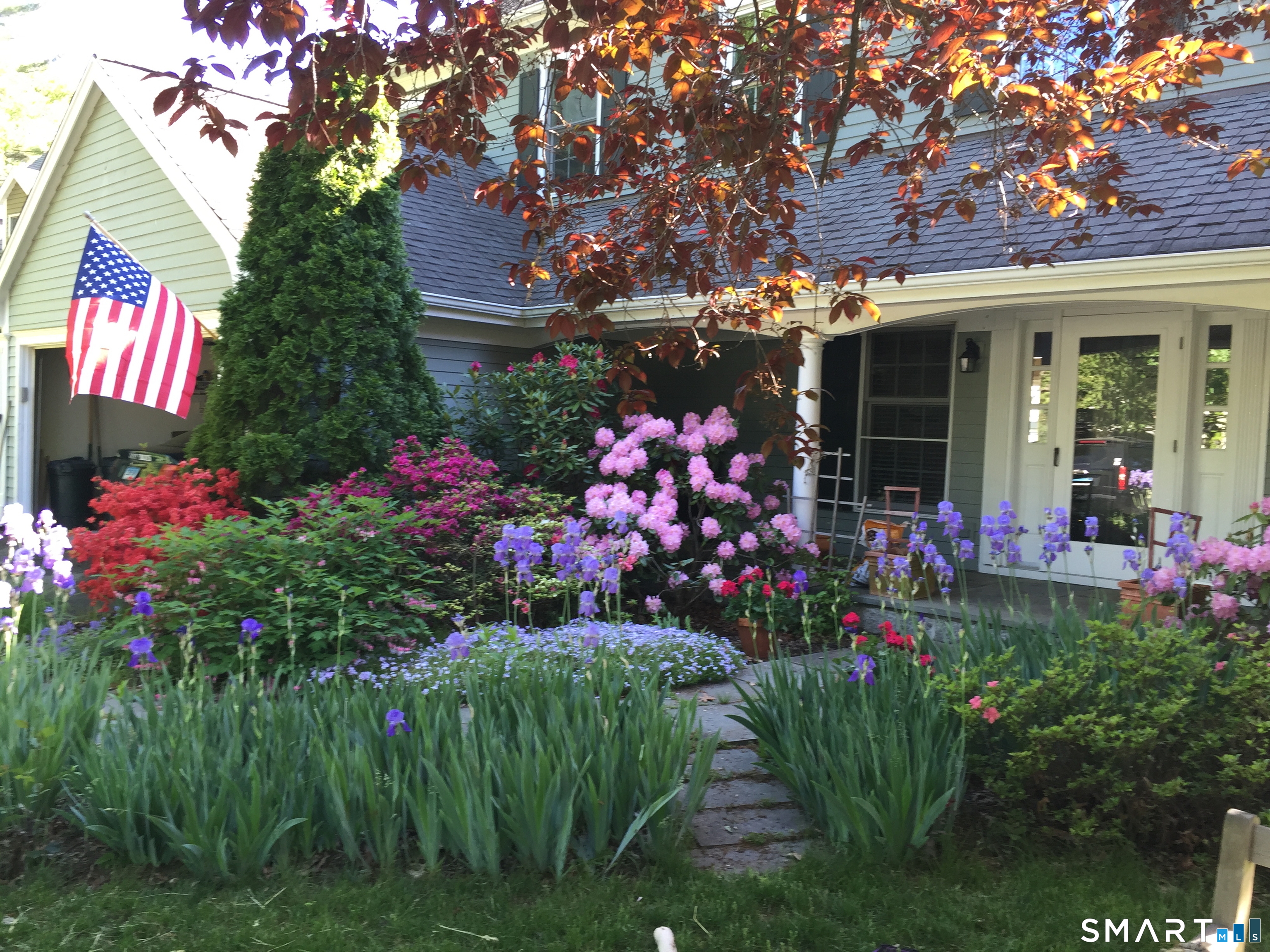 43 Phillips Lane Darien, CT 06820 - Photo 26 of 29 a view of a flowers in front of house