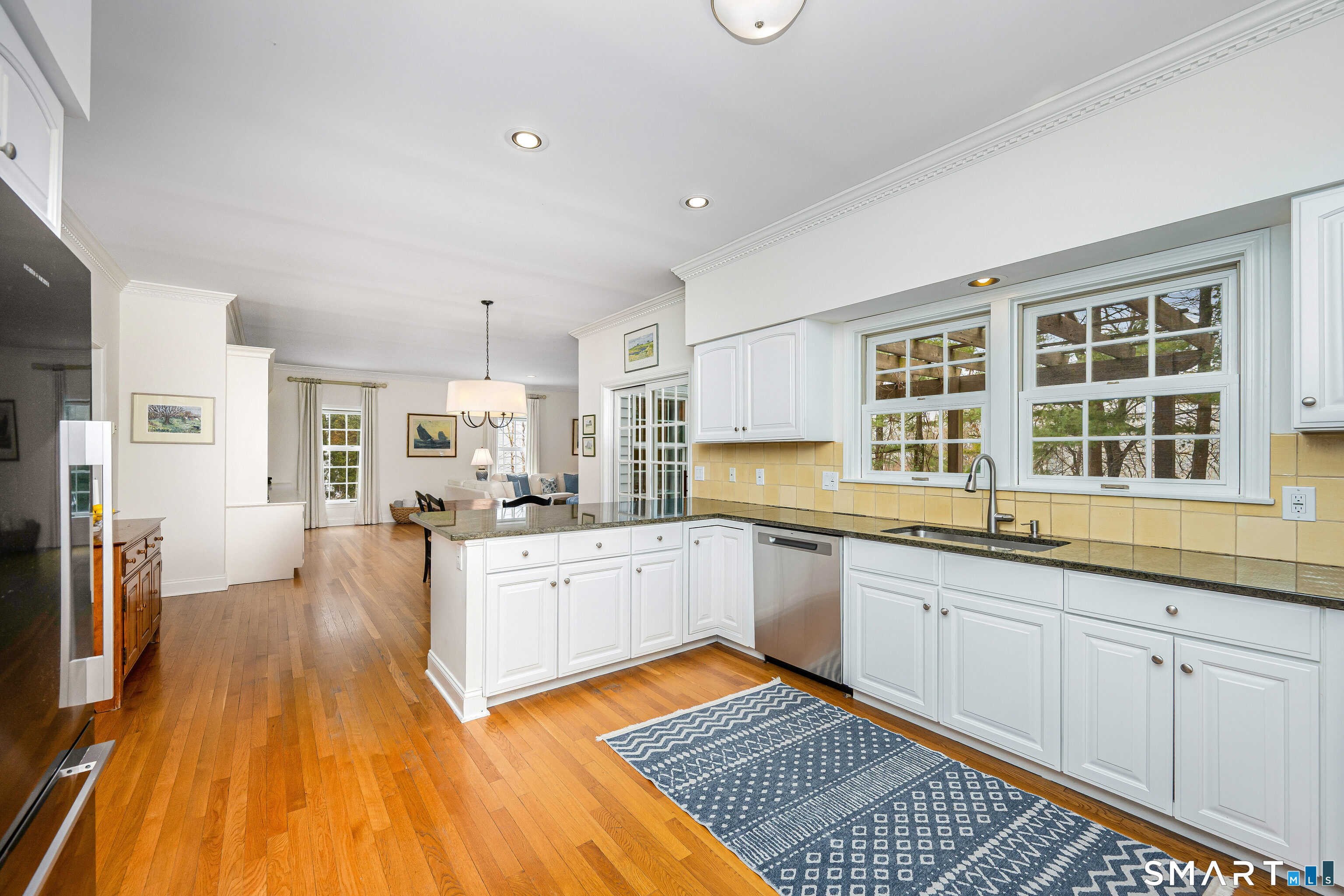 43 Phillips Lane Darien, CT 06820 - Photo 5 of 29 a large kitchen with a lot of counter space and wooden floor