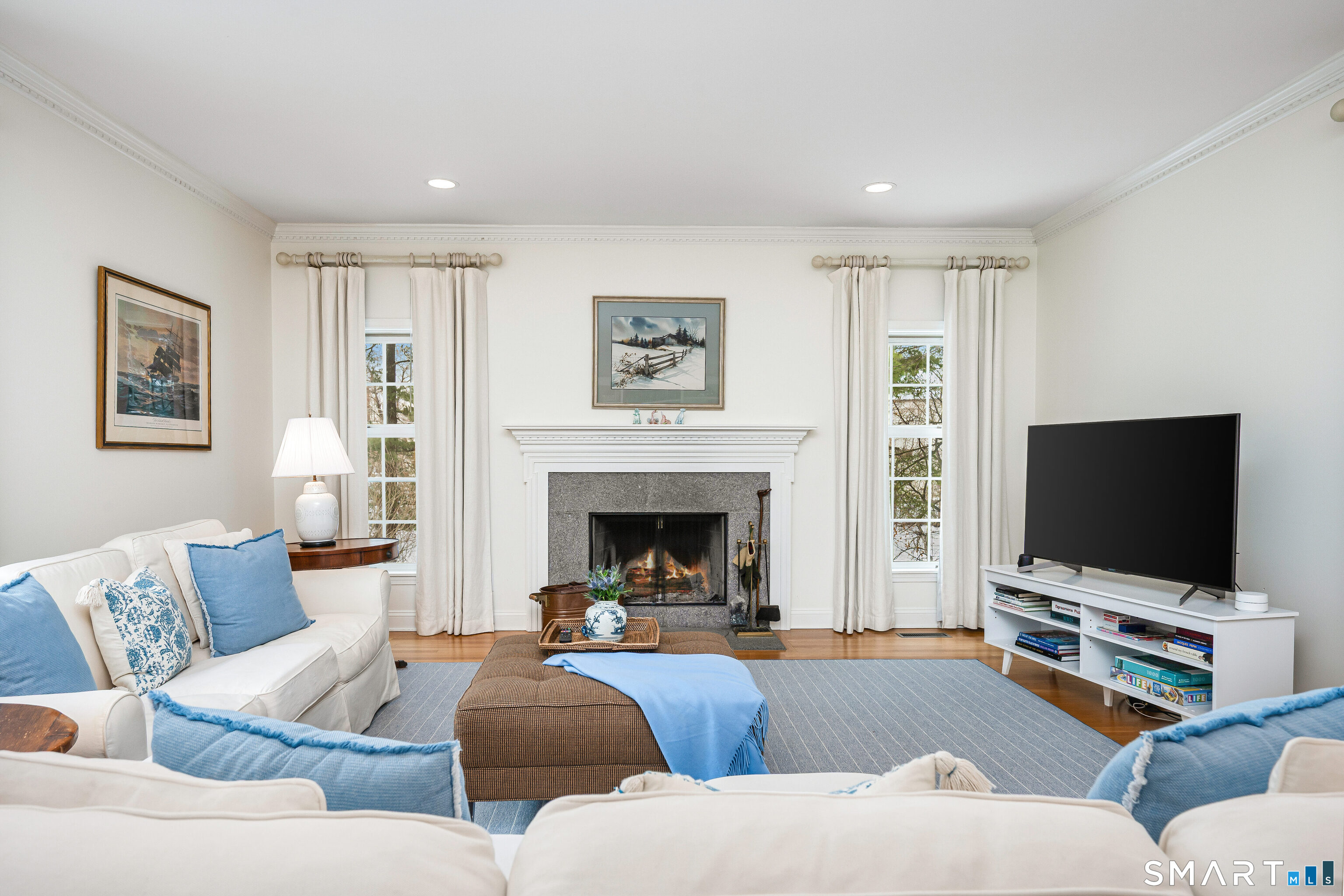 43 Phillips Lane Darien, CT 06820 - Photo 7 of 29 a living room with furniture and a flat screen tv