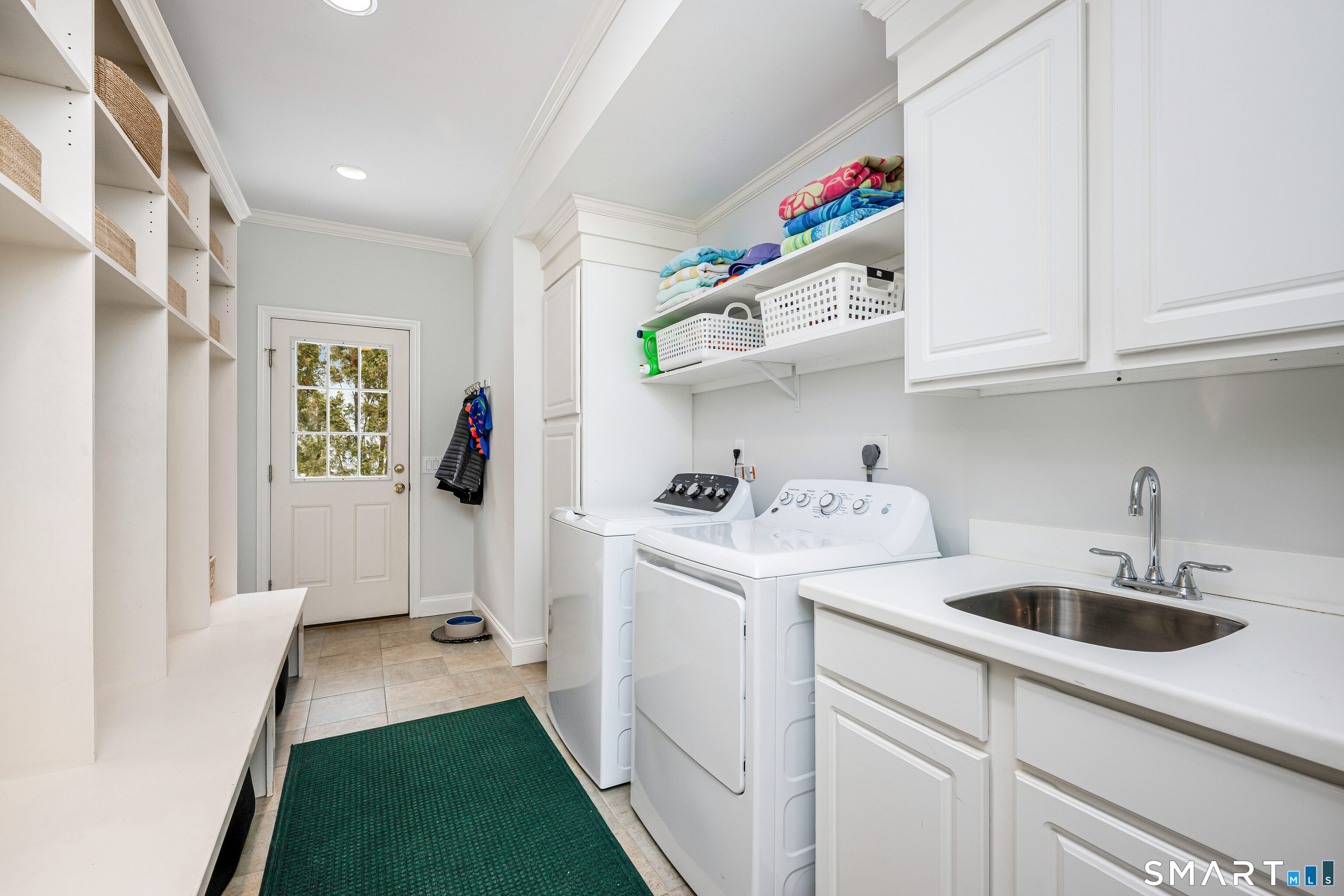 43 Phillips Lane Darien, CT 06820 - Photo 8 of 29 a utility room with sink dryer and washer