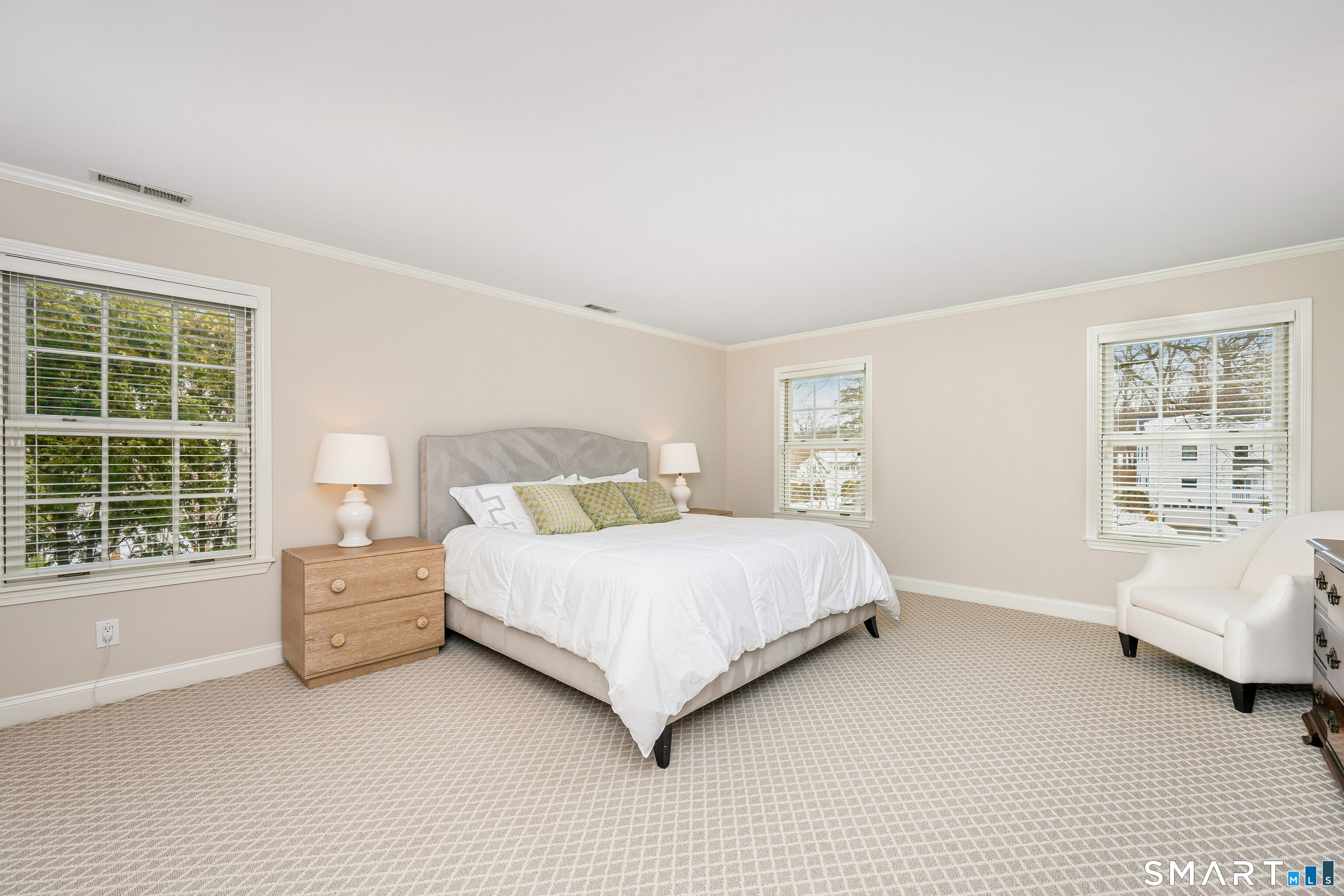 43 Phillips Lane Darien, CT 06820 - Photo 10 of 29 a bedroom with a large bed and a window