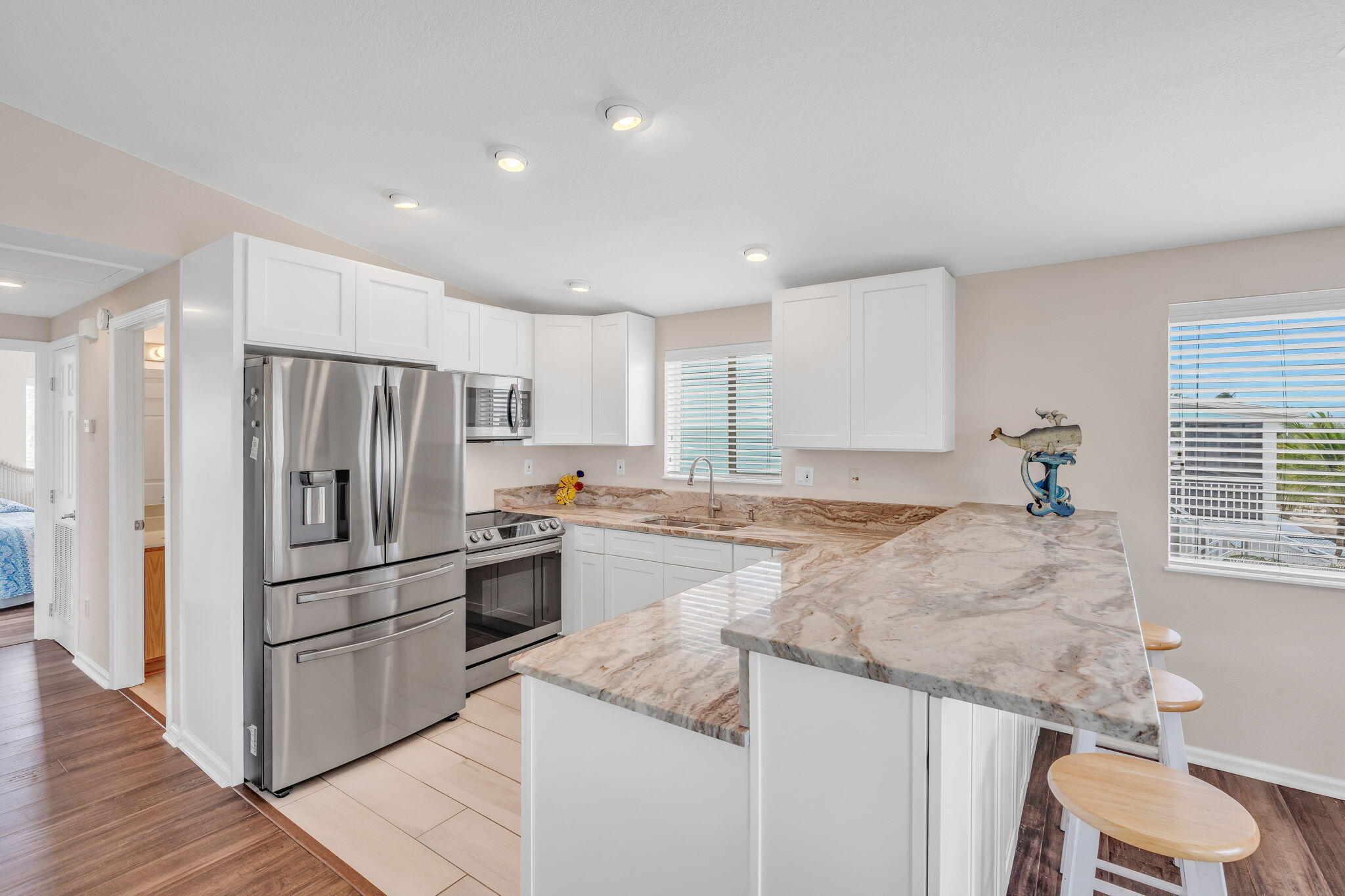 28571 Buccaneer Road Summerland Key, FL 33042 - Photo 12 of 40 a kitchen with granite countertop a sink stainless steel appliances and window