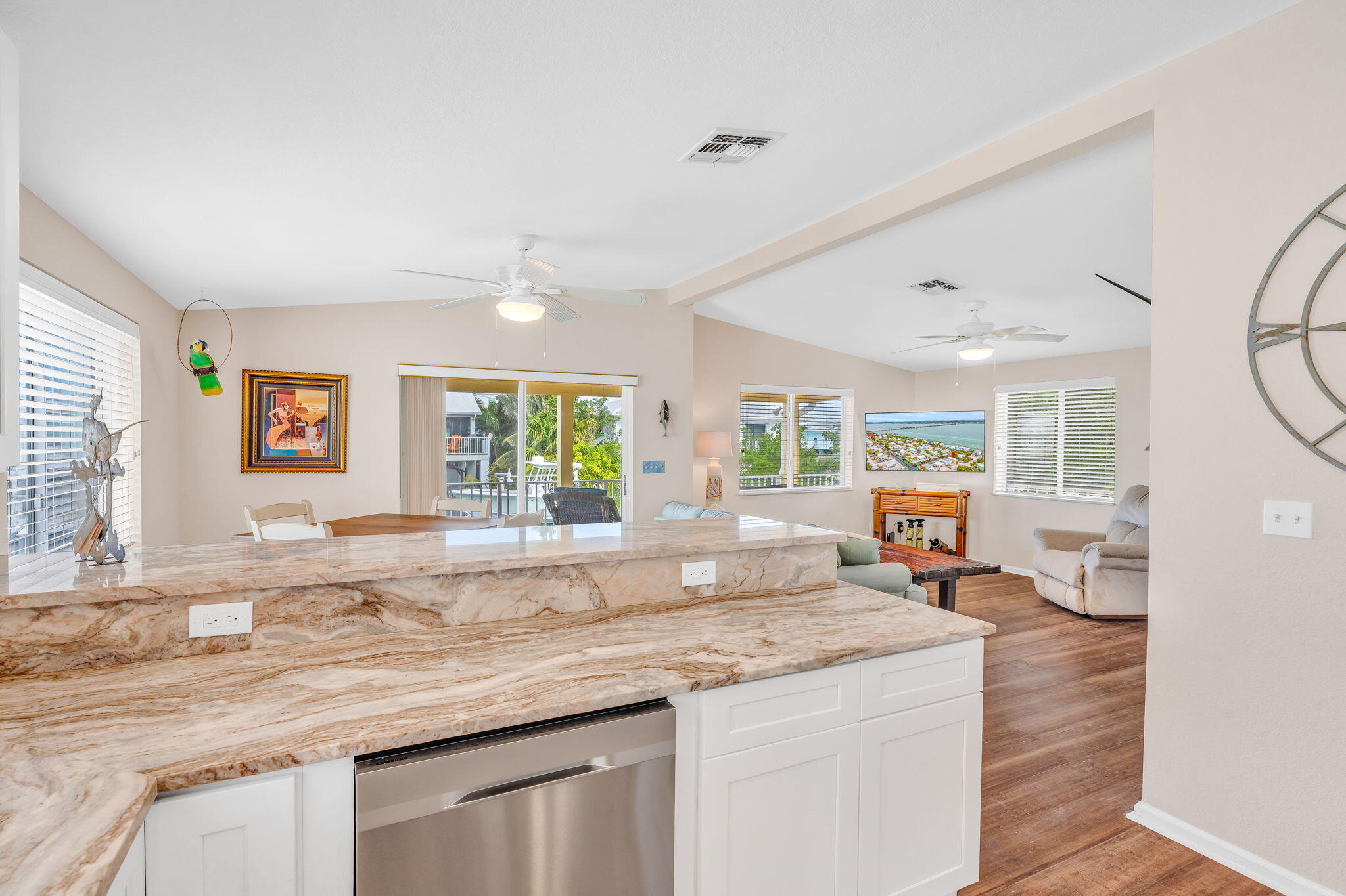 28571 Buccaneer Road Summerland Key, FL 33042 - Photo 13 of 40 a kitchen with granite countertop a sink and a stove