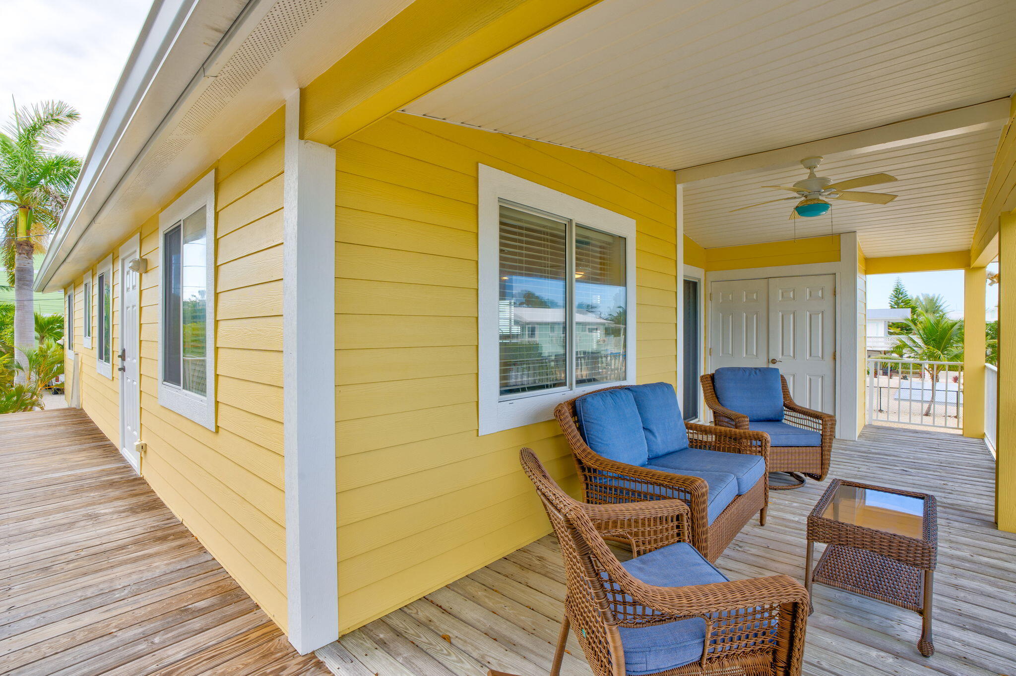 28571 Buccaneer Road Summerland Key, FL 33042 - Photo 31 of 40 a blue bench sitting in front of a building
