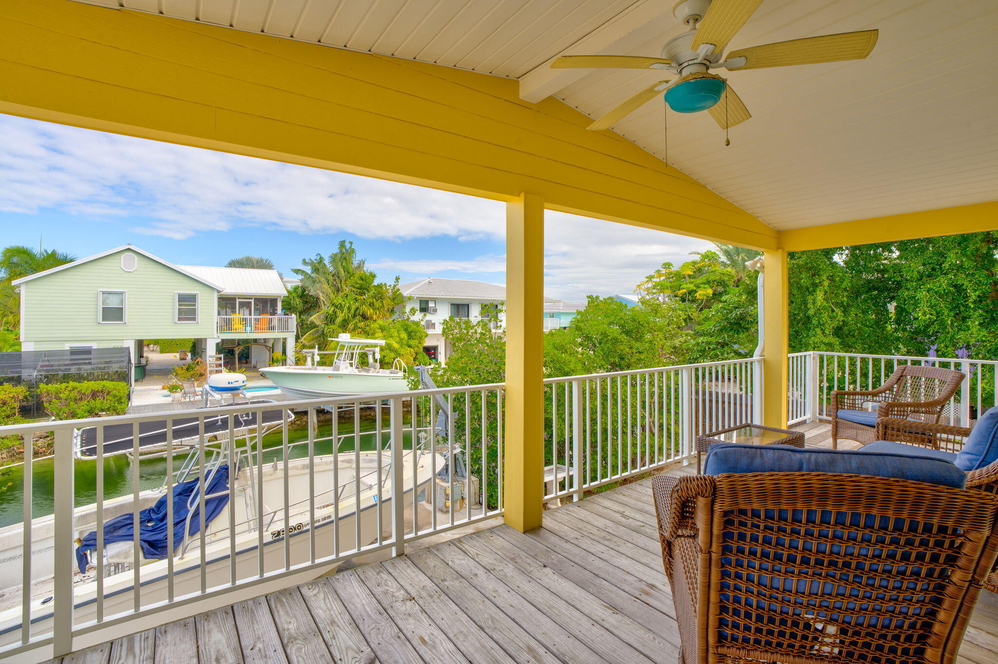 28571 Buccaneer Road Summerland Key, FL 33042 - Photo 32 of 40 a view of a balcony with floor to ceiling windows with wooden floor