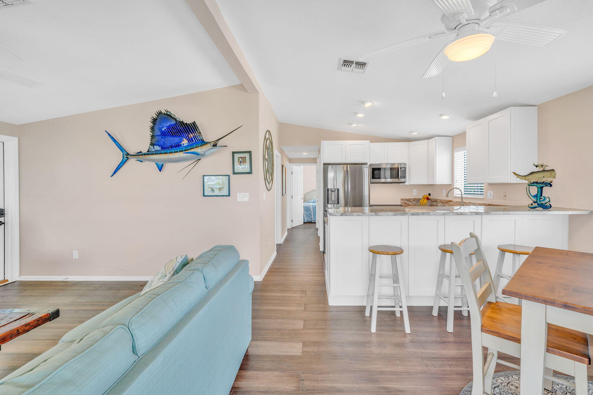 28571 Buccaneer Road Summerland Key, FL 33042 - Photo 9 of 40 a living room with stainless steel appliances furniture a dining table and kitchen view