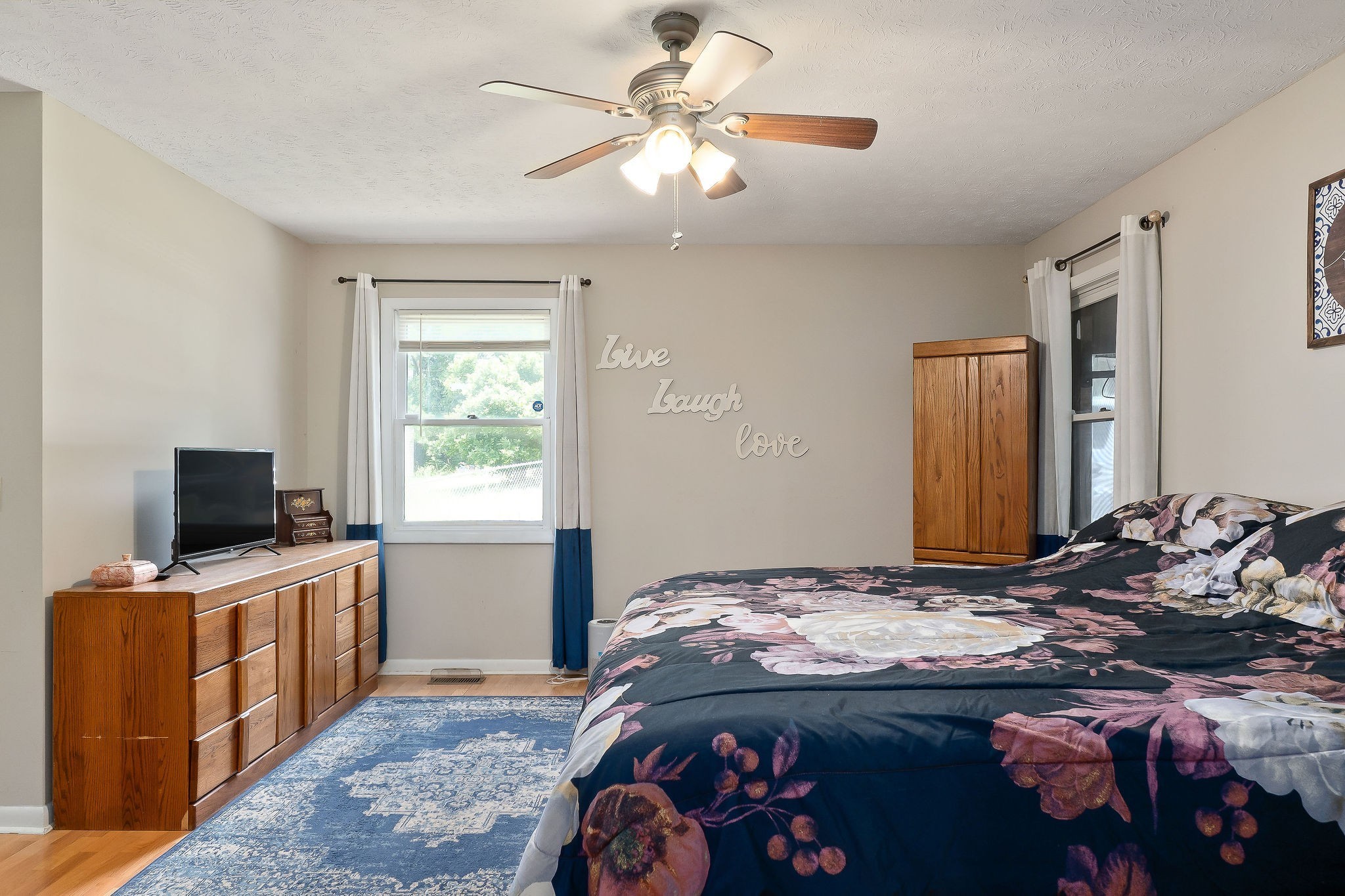 618 Cash Dollar Road Walling, TN 38587 - Photo 11 of 60 a bedroom that has a bed and a flat tv screen on wall