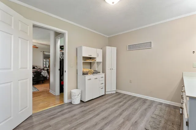 a view of a bathroom with a sink and a mirror