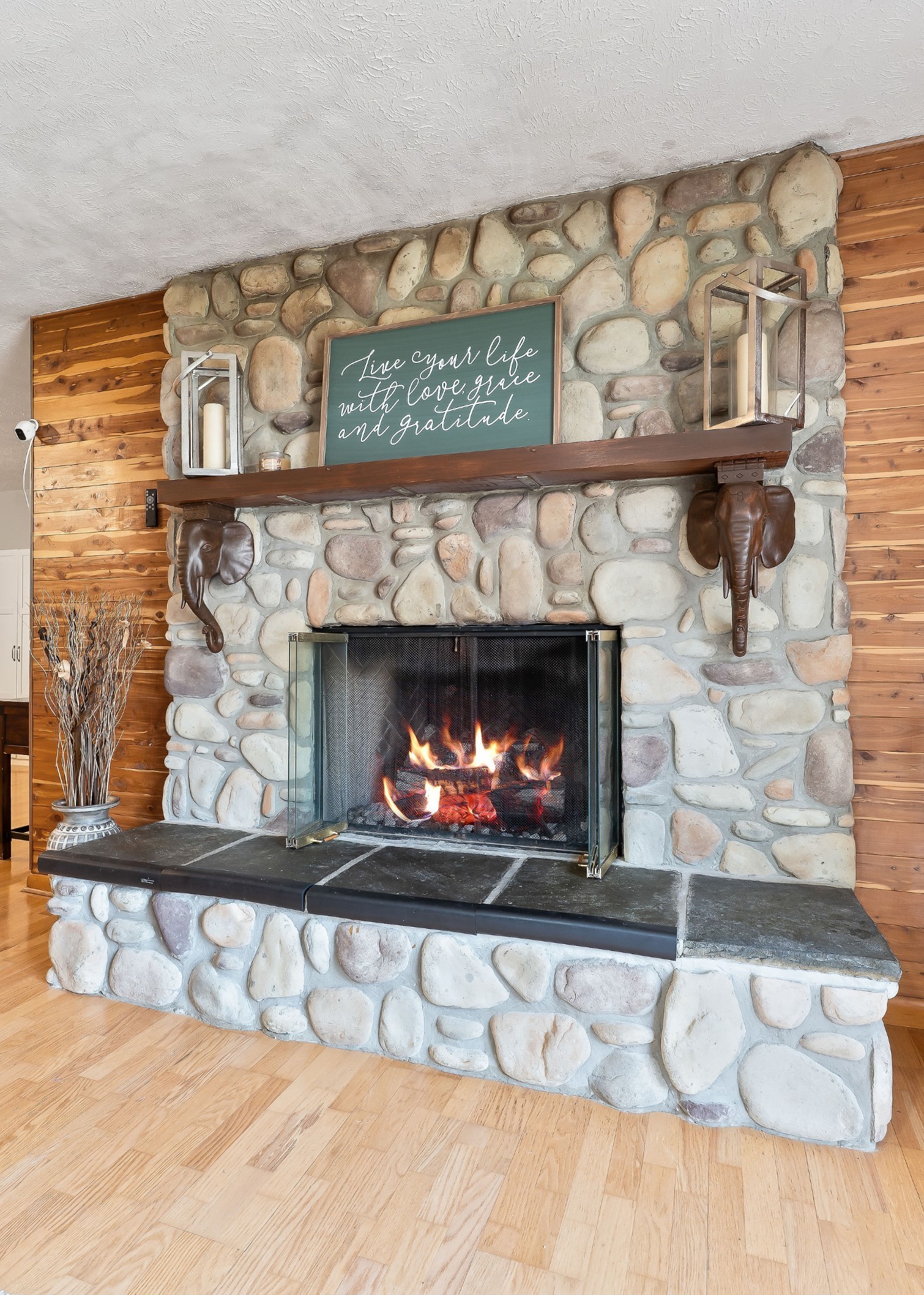 618 Cash Dollar Road Walling, TN 38587 - Photo 20 of 60 a fireplace with a clock on wall