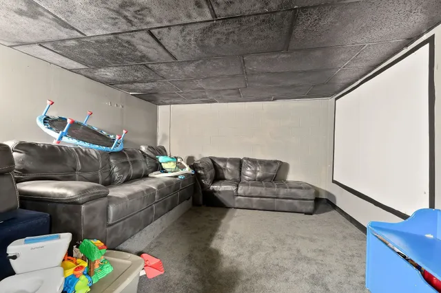 a view of two chairs in the balcony