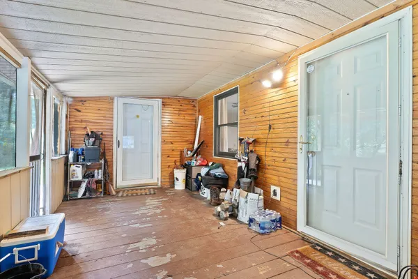 a view of a deck with furniture and yard