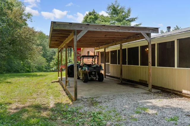 a view of balcony with wooden floor and outdoor seating
