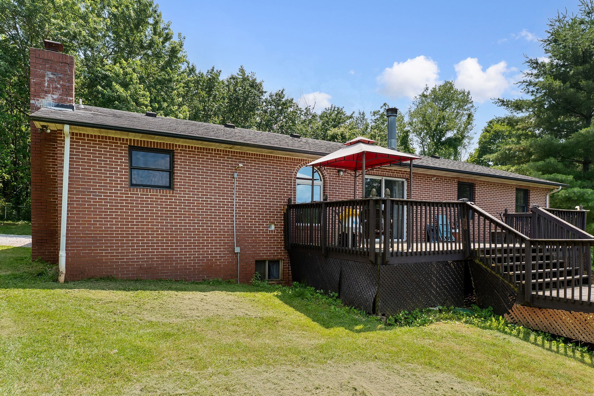 618 Cash Dollar Road Walling, TN 38587 - Photo 40 of 60 a view of a house with wooden deck and a yard