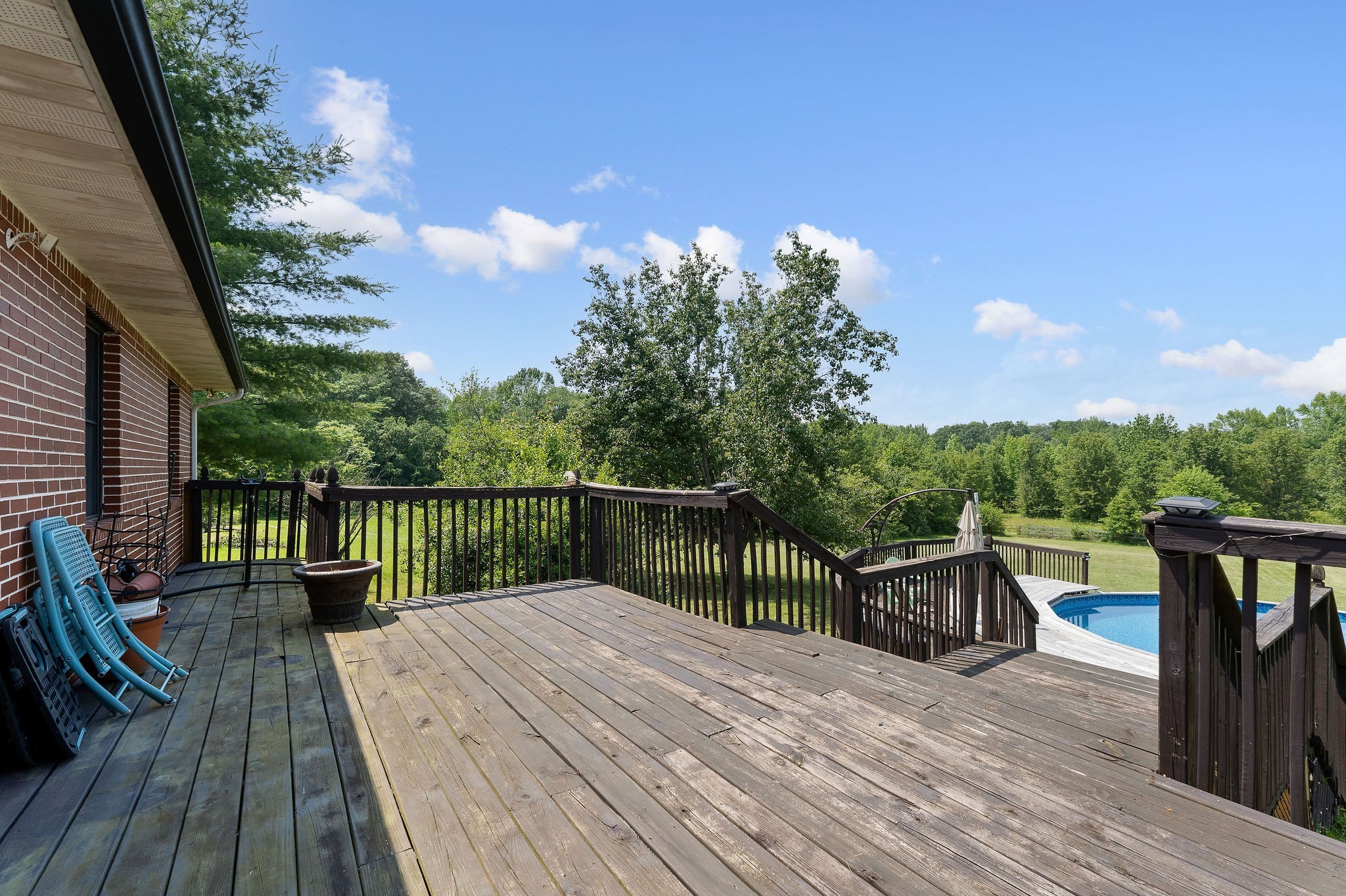 618 Cash Dollar Road Walling, TN 38587 - Photo 42 of 60 a balcony with wooden floor table and chairs