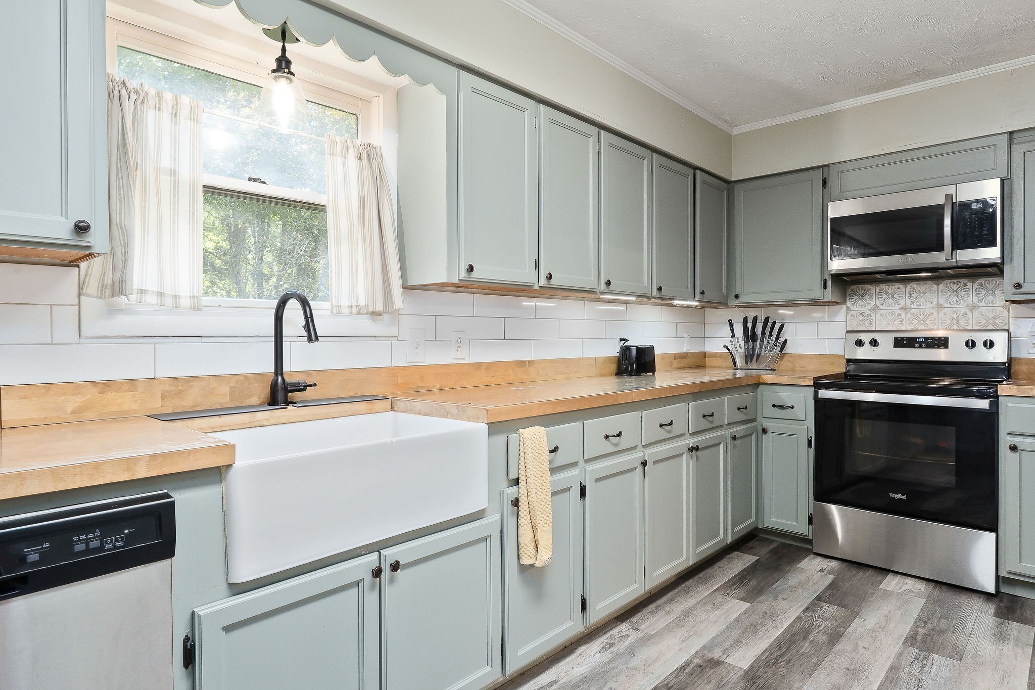 618 Cash Dollar Road Walling, TN 38587 - Photo 7 of 60 a kitchen with a sink stove and microwave