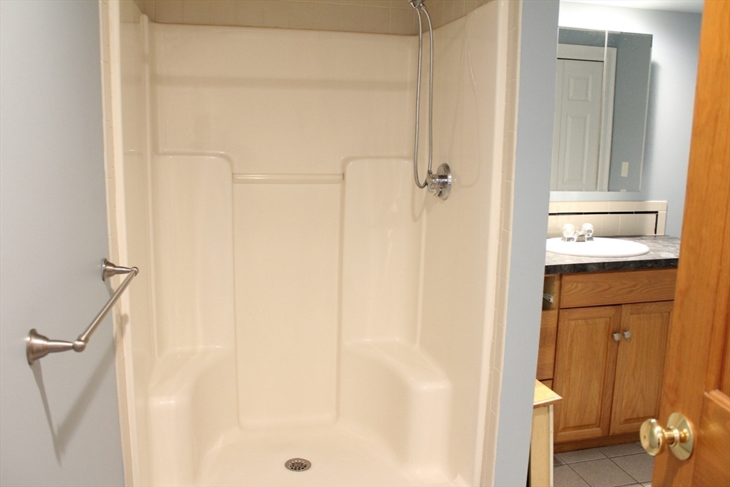 700 Wrentham Road, Unit 2 Bellingham, MA 02019 - Photo 15 of 23 a bathroom with a shower and a toilet