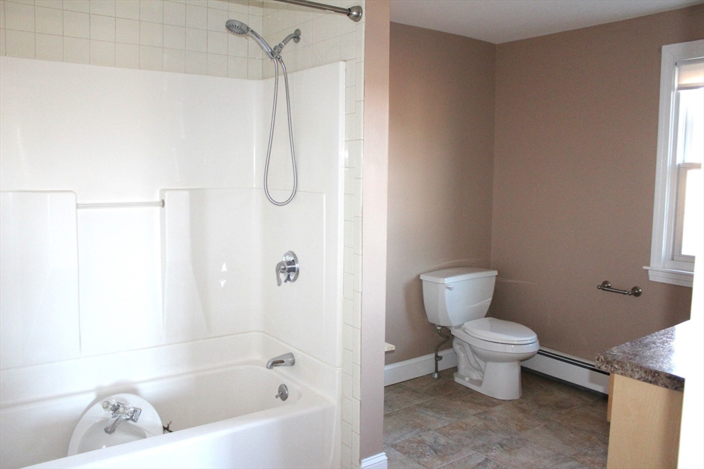 700 Wrentham Road, Unit 2 Bellingham, MA 02019 - Photo 20 of 23 a bathroom with a toilet and a shower