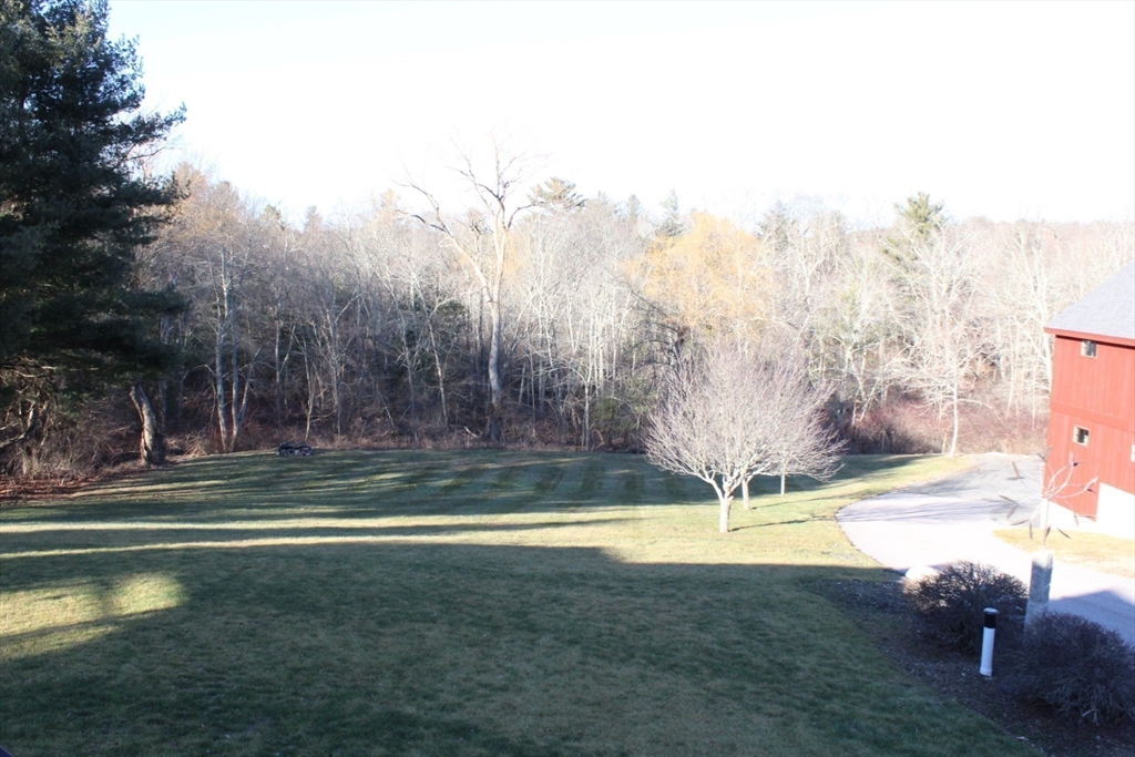 700 Wrentham Road, Unit 2 Bellingham, MA 02019 - Photo 22 of 23 a view of a swimming pool with a yard