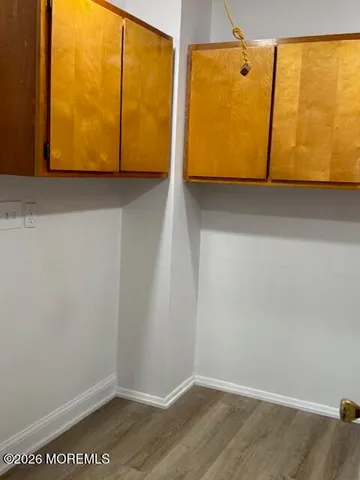 an empty room with wooden floor