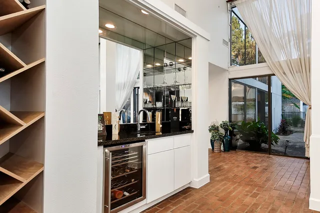 a kitchen with stainless steel appliances a refrigerator and a stove